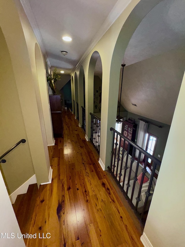 236 Sawbridge Dr, Ridgeland, MS 39157 - hall with hardwood / wood-style flooring, arched walkways, baseboards, and crown molding