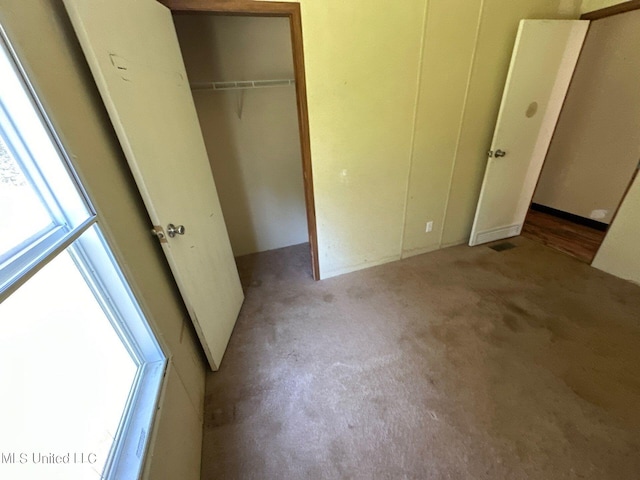 unfurnished bedroom featuring light colored carpet