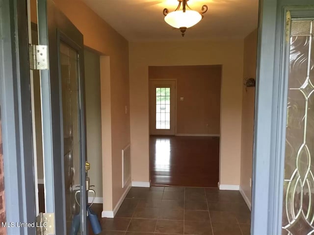 3820 Beamon Rd, Kosciusko, MS 39090 - foyer entrance featuring dark tile patterned floors and baseboards