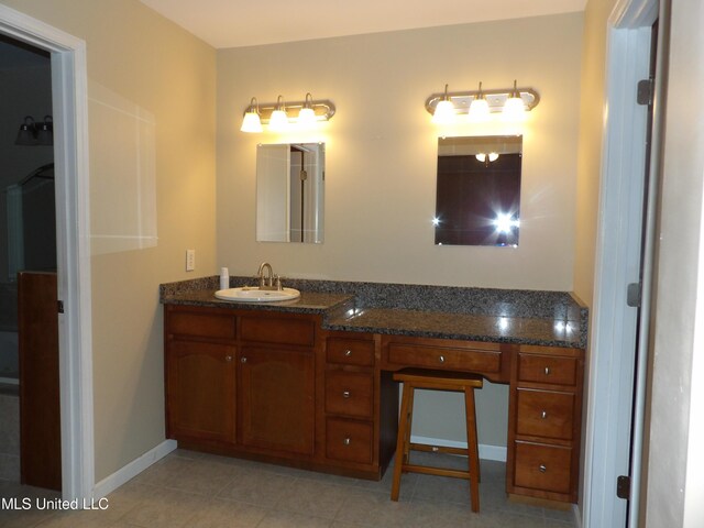 3820 Beamon Rd, Kosciusko, MS 39090 - bathroom featuring vanity, tile patterned flooring, and baseboards