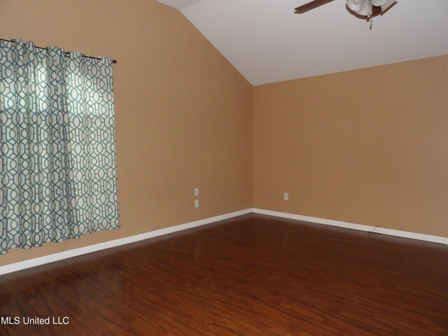 3820 Beamon Rd, Kosciusko, MS 39090 - unfurnished room with baseboards, wood finished floors, a ceiling fan, and vaulted ceiling