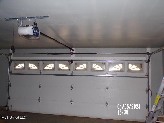 3820 Beamon Rd, Kosciusko, MS 39090 - garage featuring a garage door opener