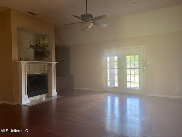 3820 Beamon Rd, Kosciusko, MS 39090 - unfurnished living room featuring a fireplace with flush hearth, a ceiling fan, visible vents, baseboards, and wood finished floors