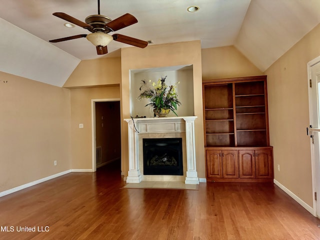 3820 Beamon Rd, Kosciusko, MS 39090 - unfurnished living room with a ceiling fan, a premium fireplace, vaulted ceiling, and wood finished floors