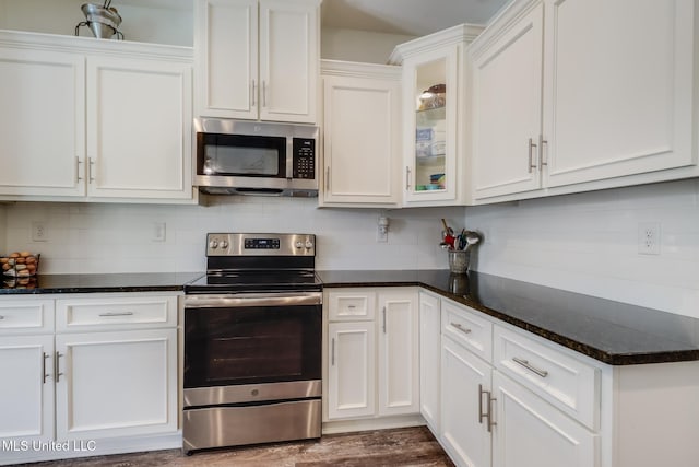 kitchen with white cabinets and appliances with stainless steel finishes