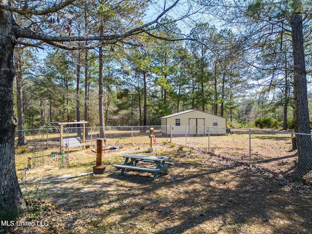 view of yard featuring an outdoor structure and fence