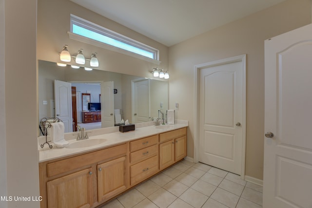 bathroom with tile patterned flooring and vanity