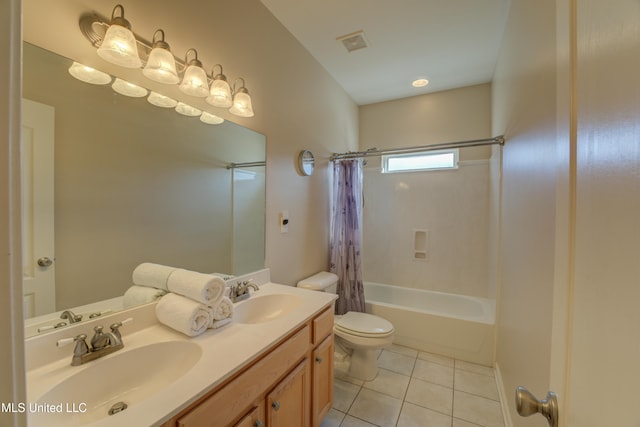 full bathroom featuring toilet, tile patterned floors, vanity, and shower / tub combo with curtain