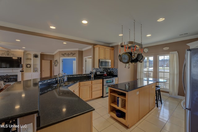 kitchen with stainless steel appliances, sink, light brown cabinets, light tile patterned floors, and a kitchen island