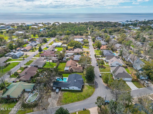 birds eye view of property featuring a residential view and a water view