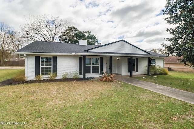 ranch-style home with brick siding, a front lawn, fence, covered porch, and a chimney