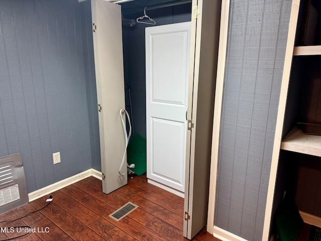 bathroom with hardwood / wood-style flooring