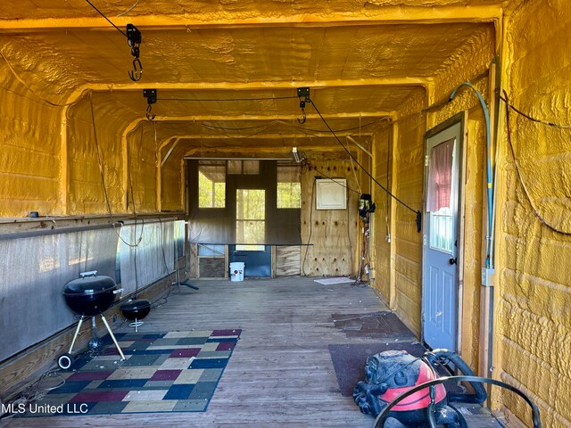 miscellaneous room featuring hardwood / wood-style flooring and plenty of natural light