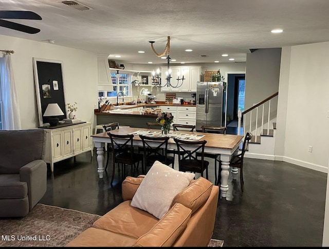 dining room with stairway, baseboards, visible vents, recessed lighting, and a notable chandelier