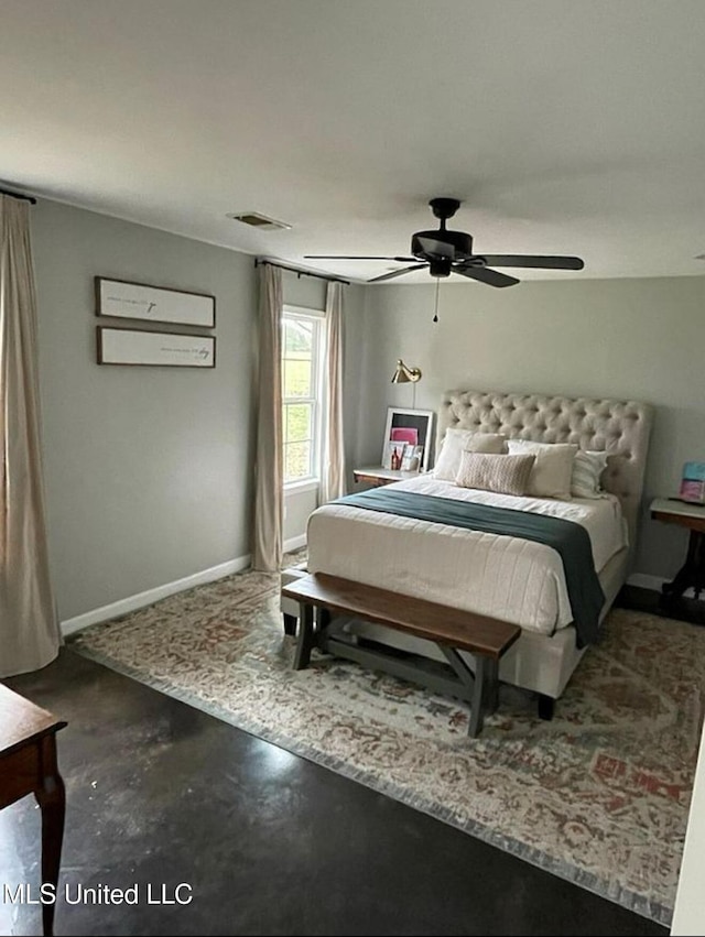 bedroom with visible vents, ceiling fan, concrete flooring, and baseboards