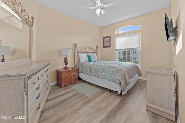 bedroom featuring light hardwood / wood-style flooring and ceiling fan