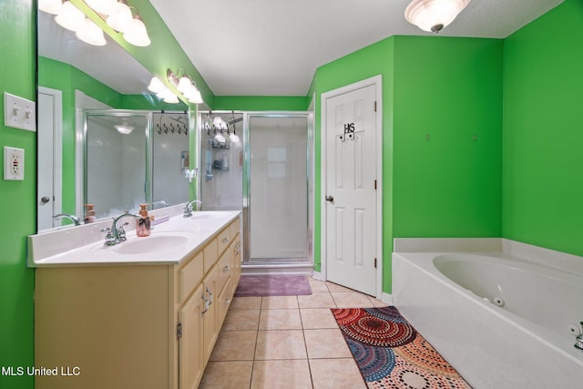 639 Plantation Way, Byhalia, MS 38611 - full bath featuring double vanity, a stall shower, a tub with jets, and tile patterned floors