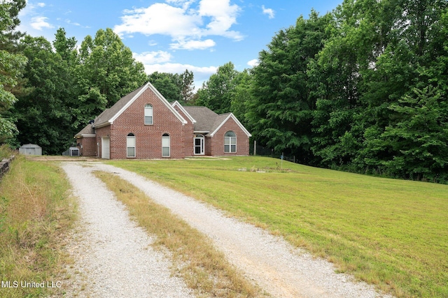 639 Plantation Way, Byhalia, MS 38611 - view of front of house with brick siding, driveway, and a front yard