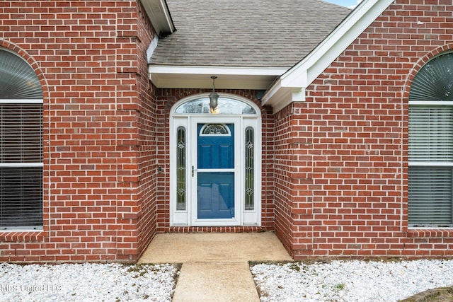 639 Plantation Way, Byhalia, MS 38611 - view of exterior entry featuring brick siding and a shingled roof