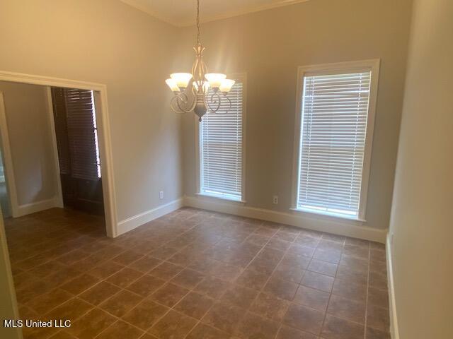 309 Barrington Cv, Byram, MS 39272 - unfurnished room featuring a chandelier and baseboards