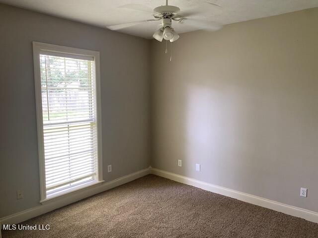 309 Barrington Cv, Byram, MS 39272 - carpeted empty room featuring a ceiling fan and baseboards