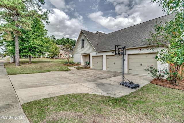 view of property exterior featuring a lawn and a garage