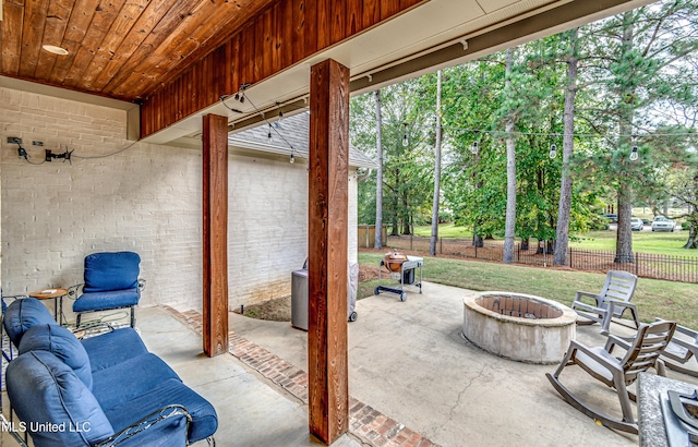 view of patio / terrace featuring an outdoor living space with a fire pit