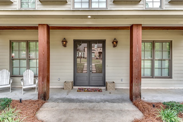 view of exterior entry with a porch