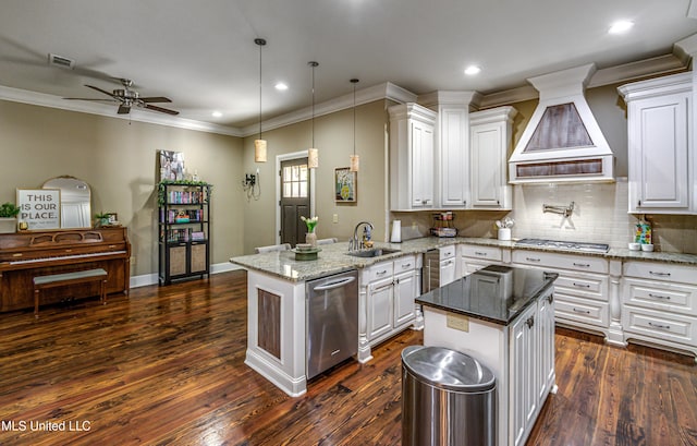 kitchen featuring kitchen peninsula, pendant lighting, dark hardwood / wood-style floors, and custom exhaust hood