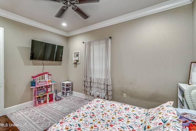 bedroom with ceiling fan, wood-type flooring, and ornamental molding