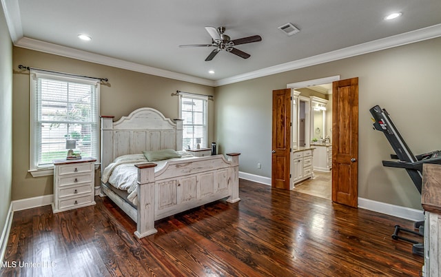 bedroom with ensuite bath, ceiling fan, crown molding, and dark hardwood / wood-style floors