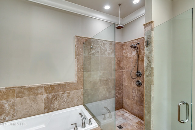 bathroom with separate shower and tub