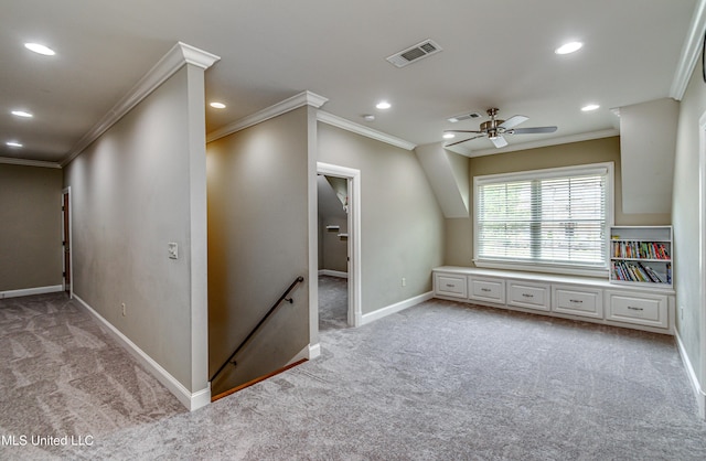 additional living space with ceiling fan and light carpet