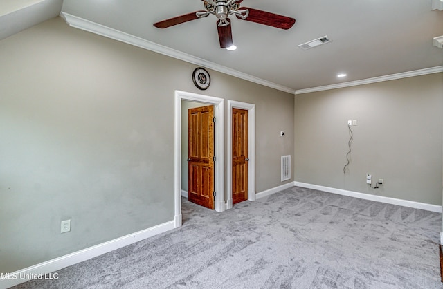 carpeted empty room with ceiling fan and ornamental molding