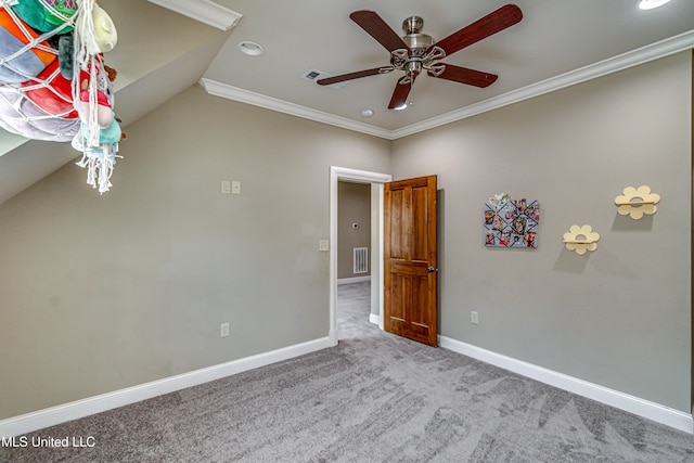 unfurnished room with carpet floors, crown molding, ceiling fan, and lofted ceiling