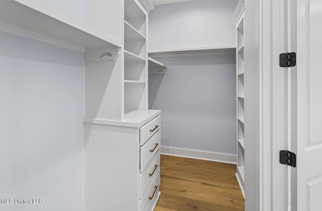 135 Genoa Dr, Madison, MS 39110 - walk in closet with wood finished floors