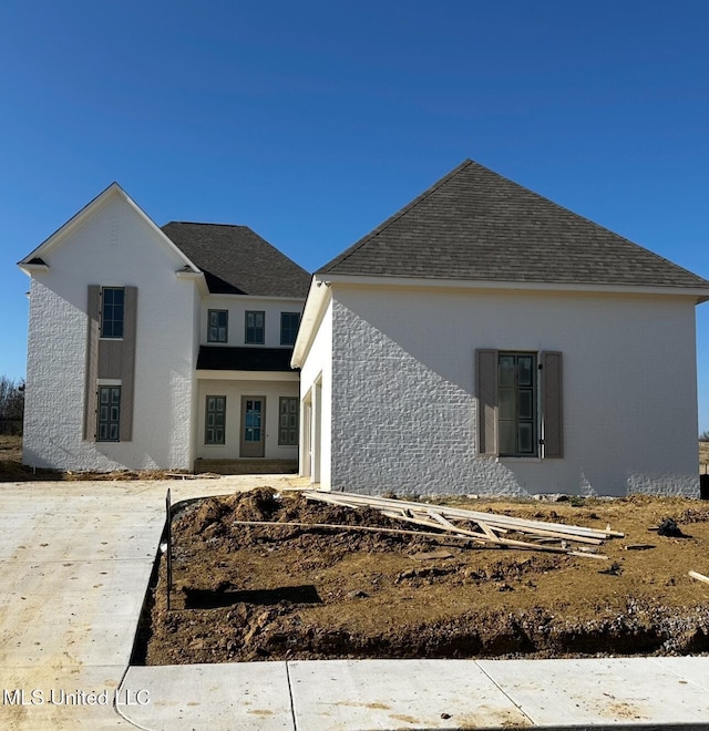 135 Genoa Dr, Madison, MS 39110 - view of front facade featuring roof with shingles and stucco siding