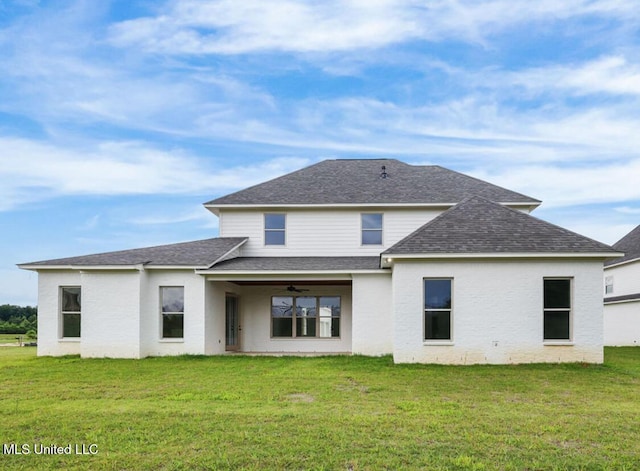 135 Genoa Dr, Madison, MS 39110 - rear view of property featuring a shingled roof, a ceiling fan, and a lawn