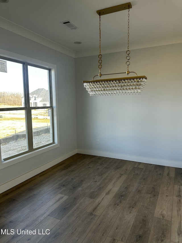 135 Genoa Dr, Madison, MS 39110 - unfurnished dining area featuring crown molding and dark wood finished floors