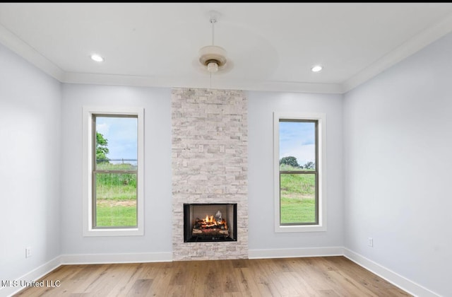 135 Genoa Dr, Madison, MS 39110 - unfurnished living room with a fireplace, plenty of natural light, wood finished floors, and recessed lighting