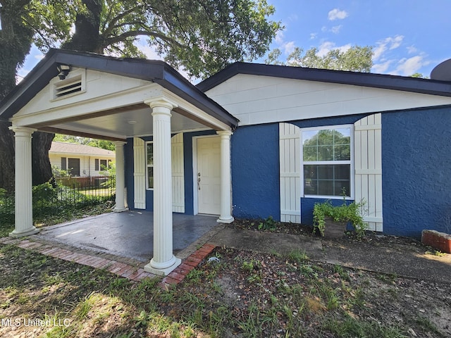 633 24th St, Gulfport, MS 39501 - neoclassical home with covered porch and stucco siding