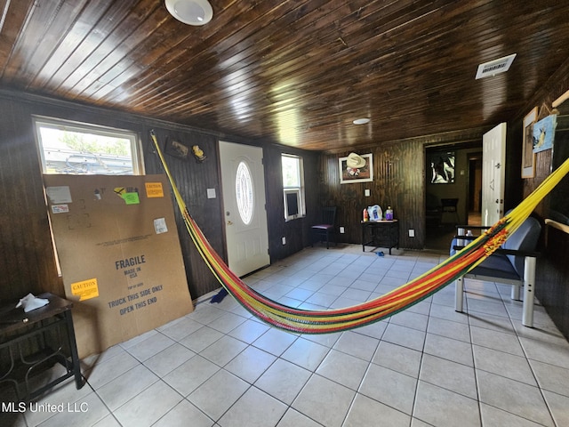 633 24th St, Gulfport, MS 39501 - tiled entryway featuring wood ceiling, healthy amount of natural light, and wood walls