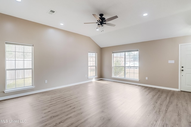 unfurnished living room featuring vaulted ceiling, ceiling fan, and light wood-type flooring