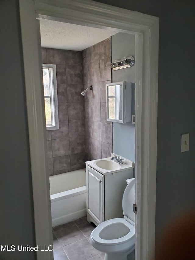2067 Corry Rd, Memphis, TN 38106 - full bath with tile patterned floors, toilet, shower / tub combination, and vanity
