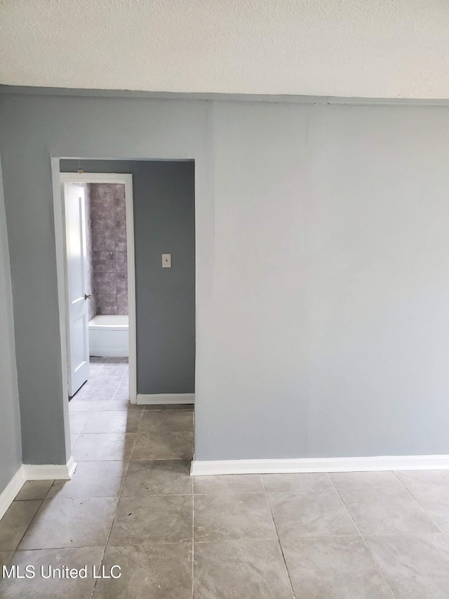 2067 Corry Rd, Memphis, TN 38106 - unfurnished room with a textured ceiling and baseboards