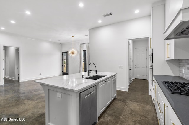 kitchen with finished concrete flooring, visible vents, stainless steel appliances, and a sink