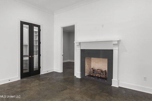 unfurnished living room with baseboards, crown molding, french doors, concrete floors, and a fireplace