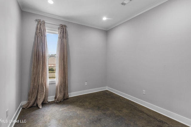 empty room with a healthy amount of sunlight, visible vents, concrete floors, and baseboards