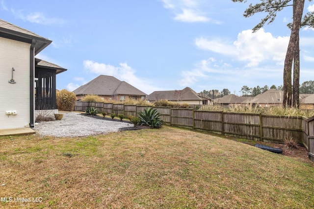 view of yard with a fenced backyard