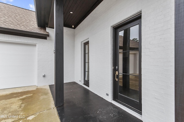 view of patio featuring an attached garage